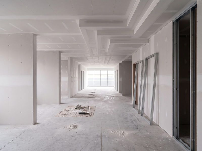 New plasterboard walls and a stepped bulkhead ceiling in a residential extension