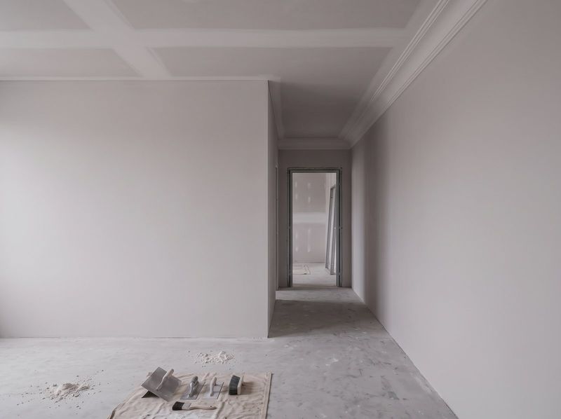 Room with a plain cornice run and a square set ceiling junction, freshly set and sanded