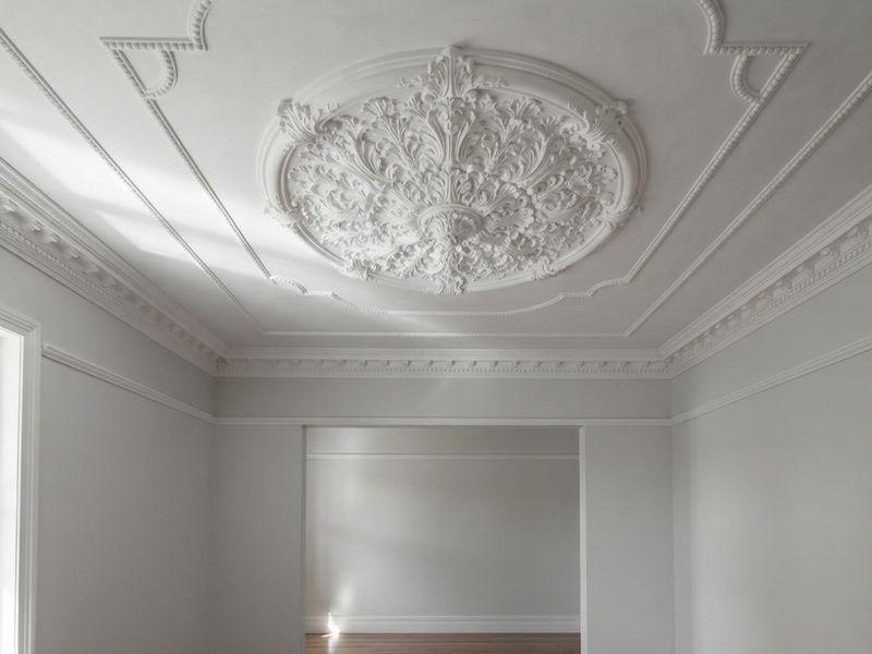 Ornate plaster ceiling rose and decorative cornice in a Federation era interior