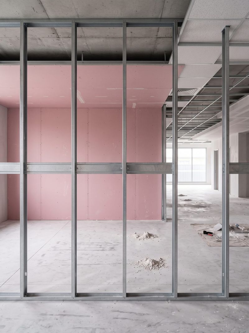 Steel stud partition framing with fire rated plasterboard sheeted on the wall behind
