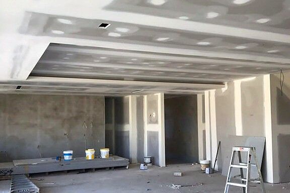 The same space with a stepped coffered ceiling set and sanded